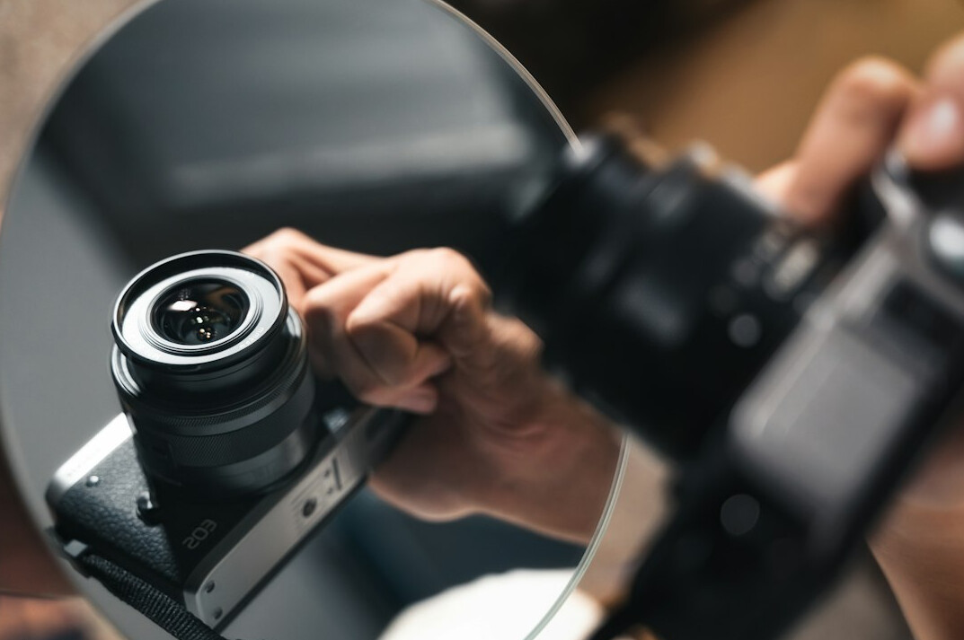 Camera operator adjusting a professional broadcast camera