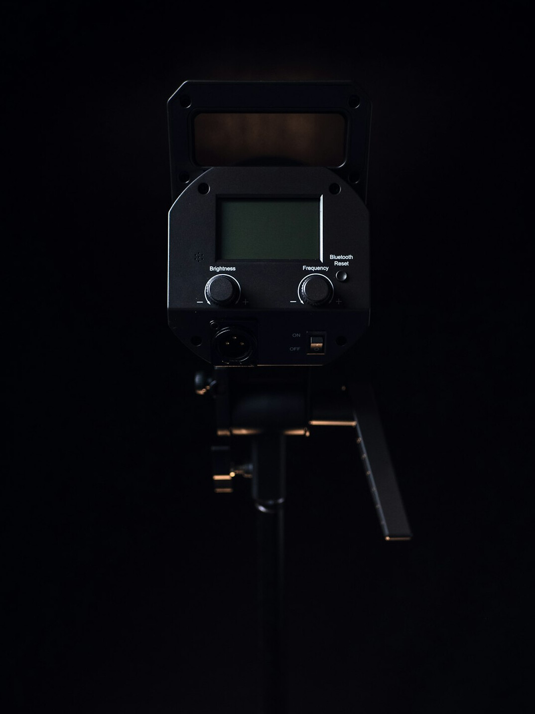 Broadcast studio camera on a pedestal mount under studio lighting